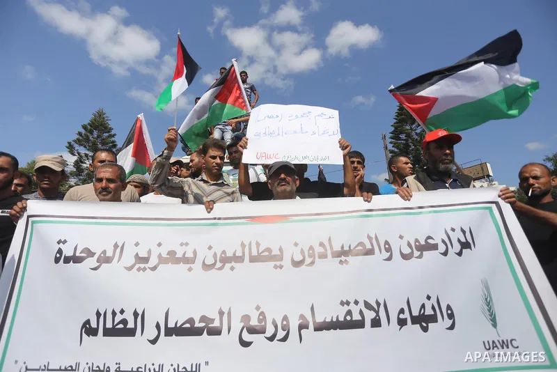 Palestinians of the Union of Agricultural Work Committees take part in a support of the Palestinian reconciliation, in Gaza city, on September 24, 2017. Palestinian President Mahmoud Abbas on Saturday said an announcemen...