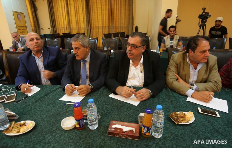 leaders of Palestinian factions attend a meeting with Hamas Chief Ismail Haniyeh and Yahya Sinwar the new leader of the Hamas Islamist movement in the Gaza Strip, in Gaza City on September 25, 2017. Photo by Mohammed Asa...
