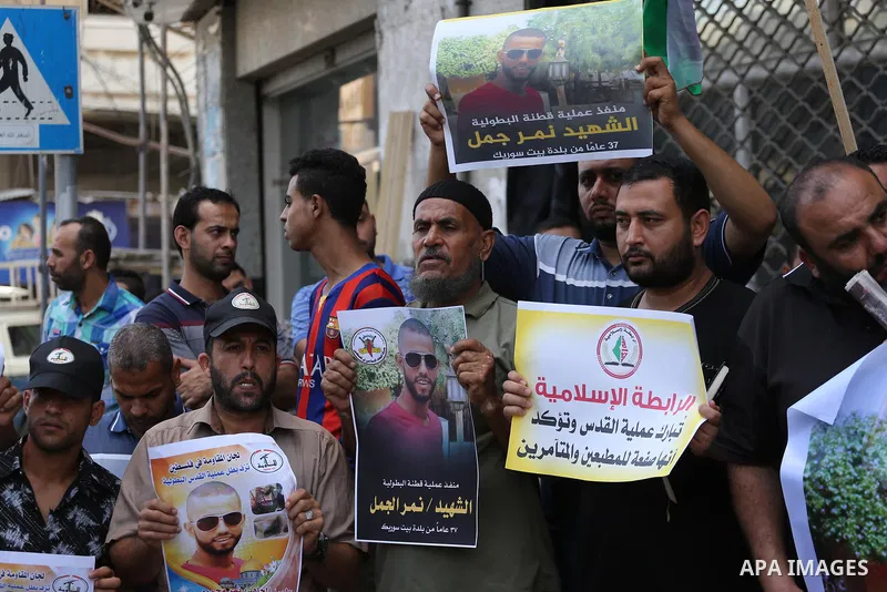 Palestinian supporters of Islamic Jihad celebrate with an attack on a Jewish settlement in the occupied West Bank, in Gaza city on September, 26, 2017. Israeli forces shot dead a Palestinian on Tuesday morning after the...