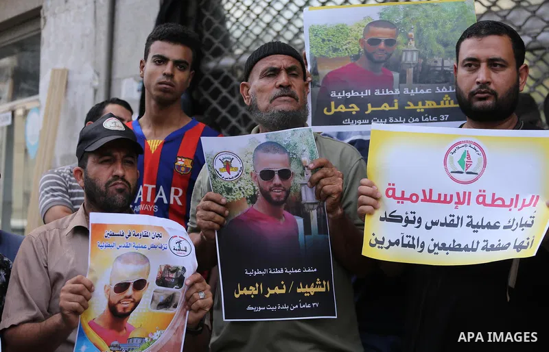 Palestinian supporters of Islamic Jihad celebrate with an attack on a Jewish settlement in the occupied West Bank, in Gaza city on September, 26, 2017. Israeli forces shot dead a Palestinian on Tuesday morning after the...