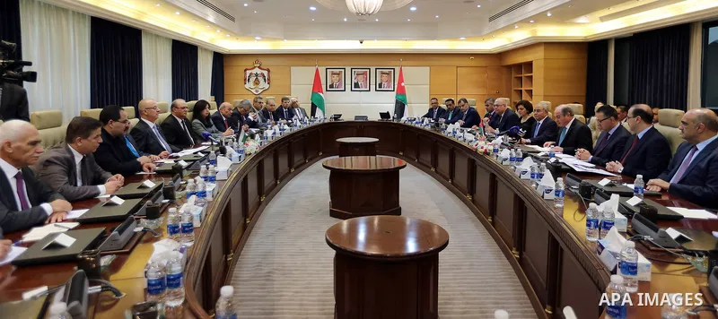 Palestinian Prime Minister Rami Hamdallah meets with Jordanian Prime Minister Hani al-Mulqi during the fifth session of the Joint Jordanian-Palestinian high committee, in the Jordanian capital Amman, on September 27, 201...