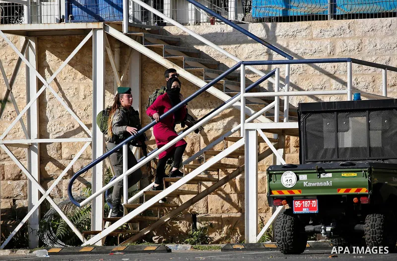 Israeli security forces detain a Palestinian girl after she allegedly tried to cross a checkpoint with a knife, near the Ibrahimi mosque, or the Tomb of the Patriarch in the West Bank city of Heborn on September 27, 2017...