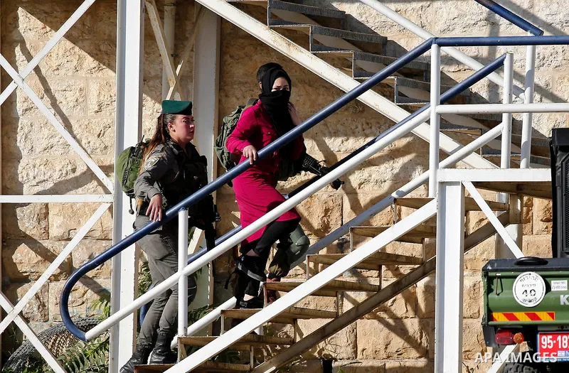 Israeli security forces detain a Palestinian girl after she allegedly tried to cross a checkpoint with a knife, near the Ibrahimi mosque, or the Tomb of the Patriarch in the West Bank city of Heborn on September 27, 2017...