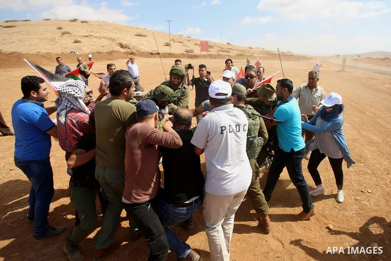Palestinian protesters scuffle with Israeli security forces during a protest against the expropriation of Palestinian land in the village of Atouf, near the west bank city of Tubas on September 27, 2017. Photo by Ayman A...