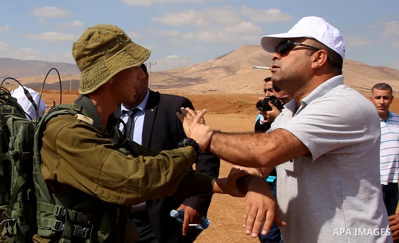 A Palestinian protester scuffles with Israeli security forces during a protest against the expropriation of Palestinian land in the village of Atouf, near the west bank city of Tubas on September 27, 2017. Photo by Ayman...