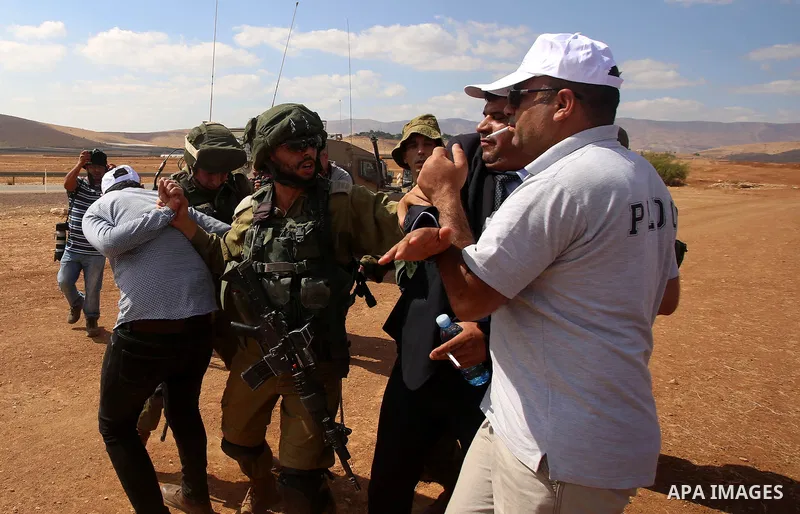 Palestinian protesters scuffle with Israeli security forces during a protest against the expropriation of Palestinian land in the village of Atouf, near the west bank city of Tubas on September 27, 2017. Photo by Ayman A...