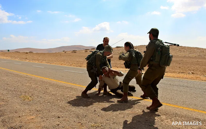 Israeli security forces detain a Palestinian protester during a protest against the expropriation of Palestinian land in the village of Atouf, near the west bank city of Tubas on September 27, 2017. Photo by Ayman Ameen