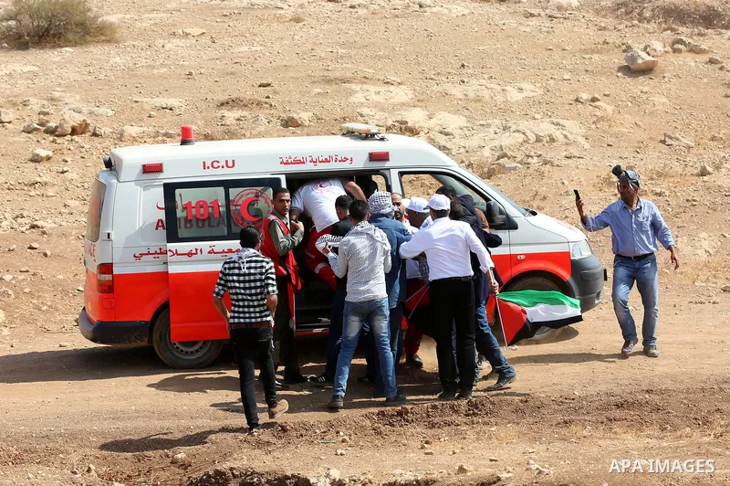 A wounded Palestinian protester is evacuated during clashes with Israeli security forces following a protest against the expropriation of Palestinian land in the village of Atouf, near the west bank city of Tubas on Sept...