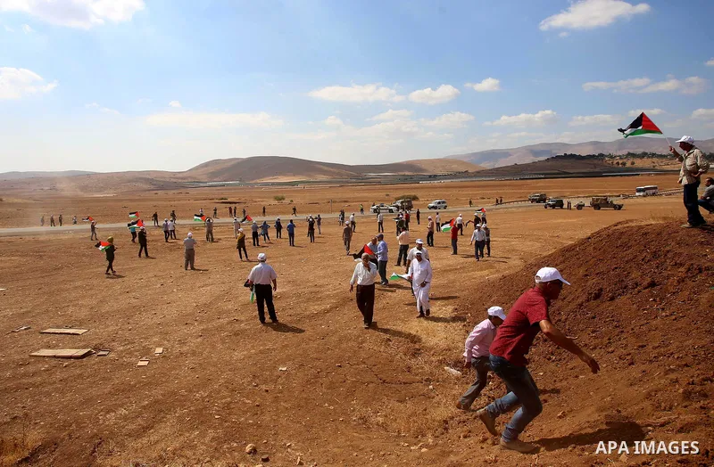 Palestinian protesters clash with Israeli security forces following a protest against the expropriation of Palestinian land in the village of Atouf, near the west bank city of Tubas on September 27, 2017. Photo by Ayman...