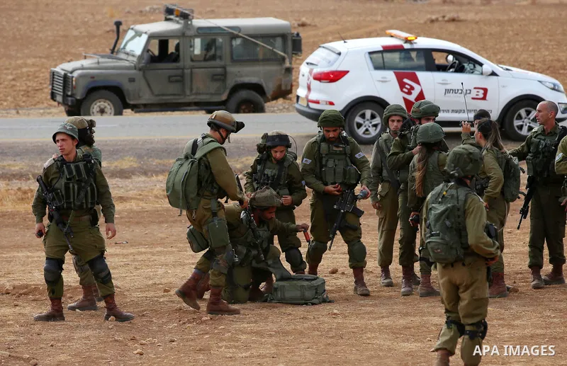 Israeli security froces take position during clashes with Palestinian protesters following a protest against the expropriation of Palestinian land in the village of Atouf, near the west bank city of Tubas on September 27...