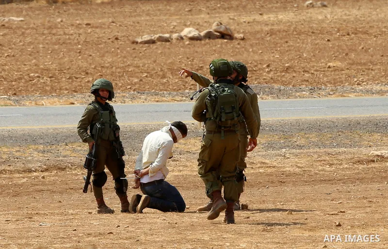 Israeli security forces detain a Palestinian protester during a protest against the expropriation of Palestinian land in the village of Atouf, near the west bank city of Tubas on September 27, 2017. Photo by Ayman Ameen