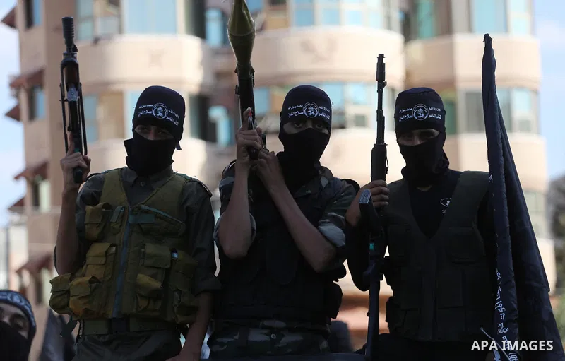 Palestinian militants from the Al-Nasser Brigades, an armed wing of the Popular Resistance Committees (PRC), take part in a military parade, in Gaza city, on September 29, 2017, to mark the 17th anniversary of the creati...