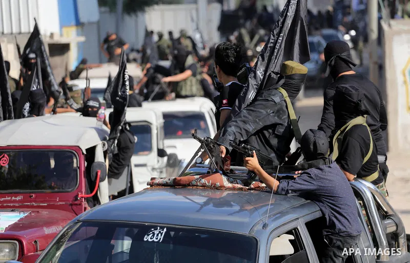 Palestinian militants from the Al-Nasser Brigades, an armed wing of the Popular Resistance Committees (PRC), take part in a military parade, in Gaza city, on September 29, 2017, to mark the 17th anniversary of the creati...