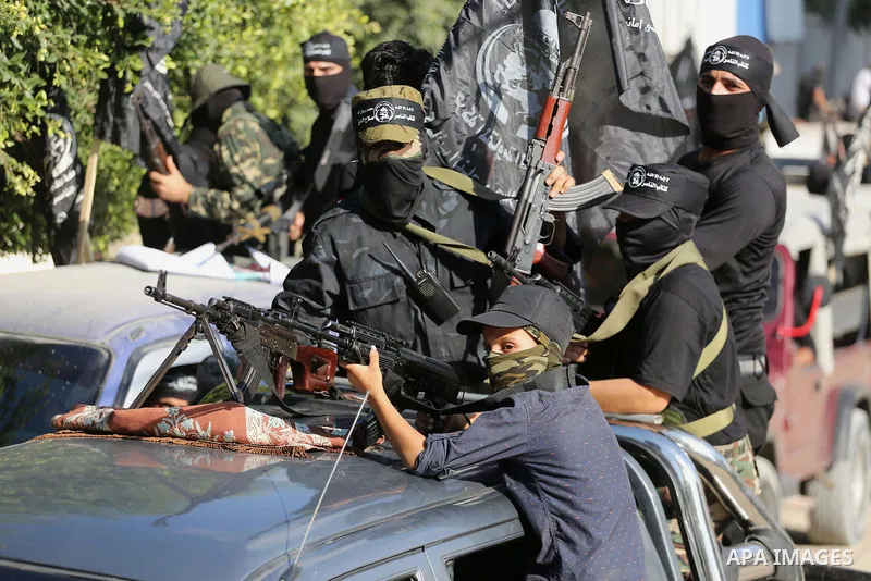 Palestinian militants from the Al-Nasser Brigades, an armed wing of the Popular Resistance Committees (PRC), take part in a military parade, in Gaza city, on September 29, 2017, to mark the 17th anniversary of the creati...