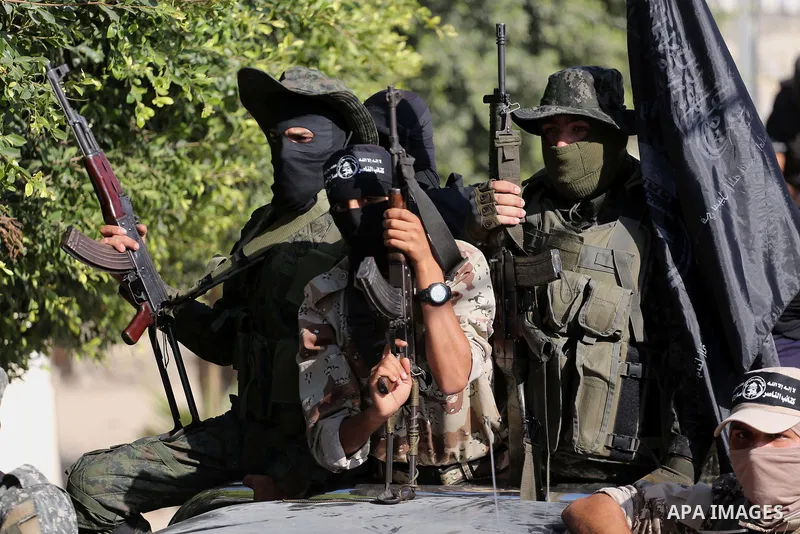 Palestinian militants from the Al-Nasser Brigades, an armed wing of the Popular Resistance Committees (PRC), take part in a military parade, in Gaza city, on September 29, 2017, to mark the 17th anniversary of the creati...