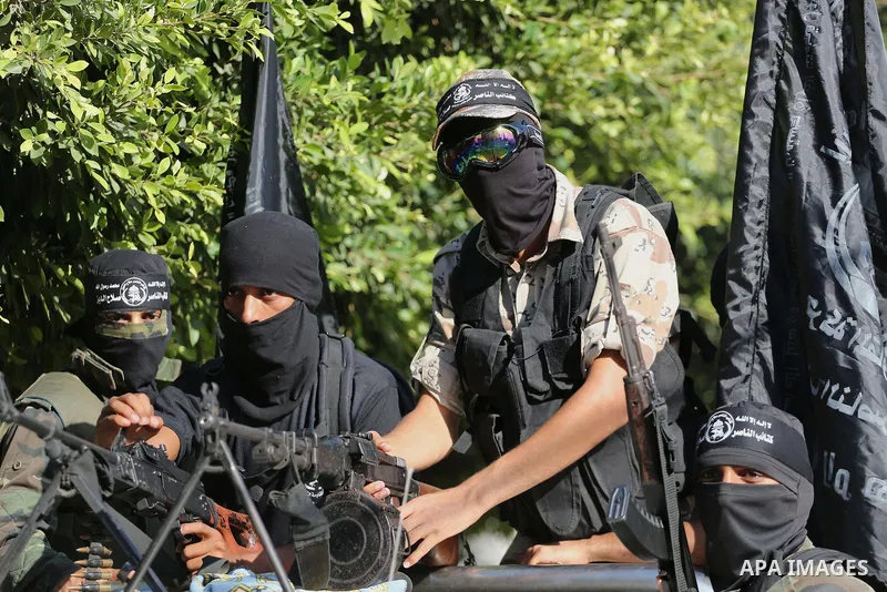 Palestinian militants from the Al-Nasser Brigades, an armed wing of the Popular Resistance Committees (PRC), take part in a military parade, in Gaza city, on September 29, 2017, to mark the 17th anniversary of the creati...