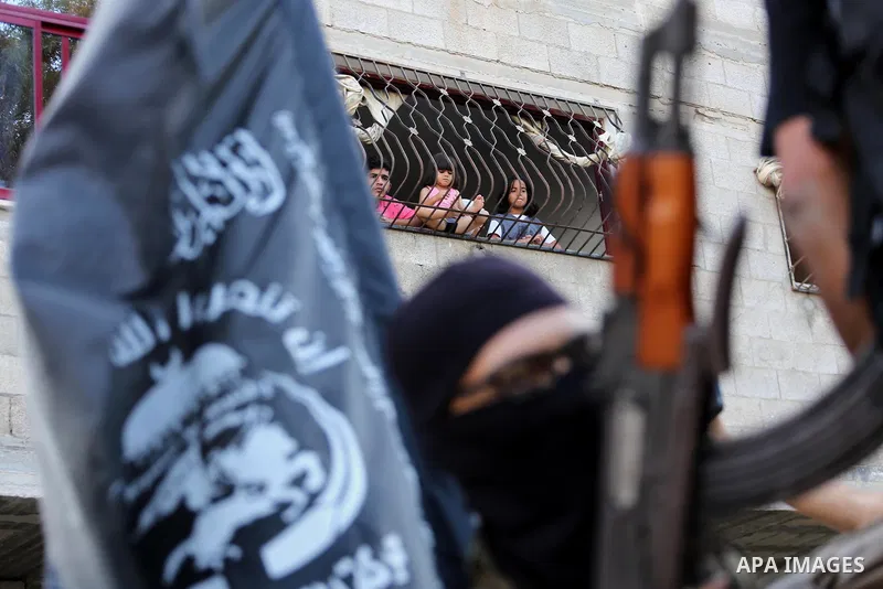 Palestinian militants from the Al-Nasser Brigades, an armed wing of the Popular Resistance Committees (PRC), take part in a military parade, in Gaza city, on September 29, 2017, to mark the 17th anniversary of the creati...