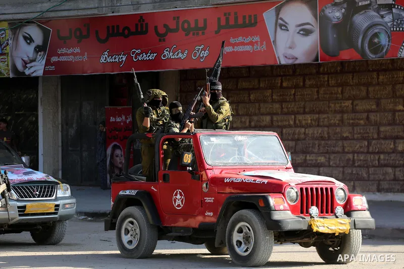 Palestinian militants from the Al-Nasser Brigades, an armed wing of the Popular Resistance Committees (PRC), take part in a military parade, in Gaza city, on September 29, 2017, to mark the 17th anniversary of the creati...