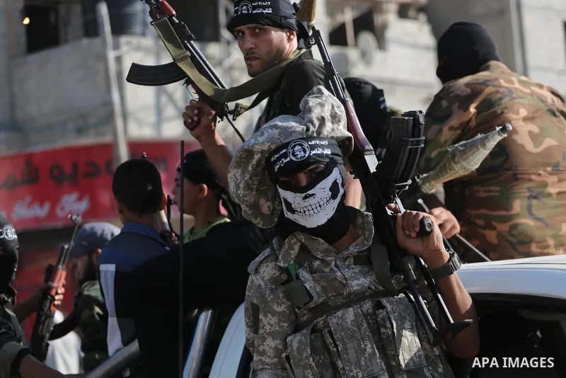 Palestinian militants from the Al-Nasser Brigades, an armed wing of the Popular Resistance Committees (PRC), take part in a military parade, in Gaza city, on September 29, 2017, to mark the 17th anniversary of the creati...