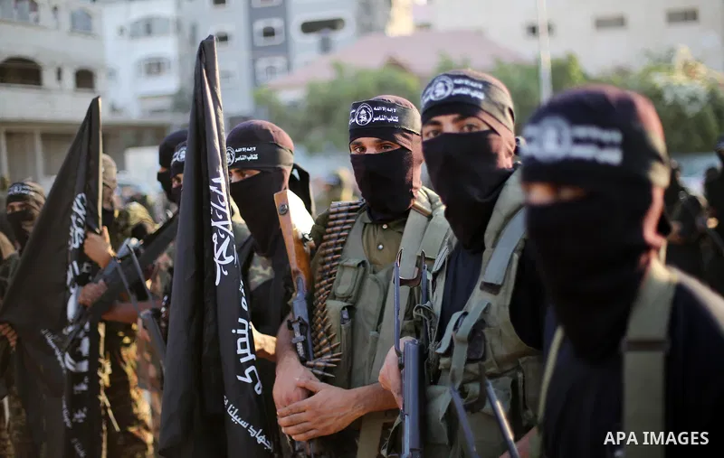 Palestinian militants from the Al-Nasser Brigades, an armed wing of the Popular Resistance Committees (PRC), take part in a military parade, in Gaza city, on September 29, 2017, to mark the 17th anniversary of the creati...