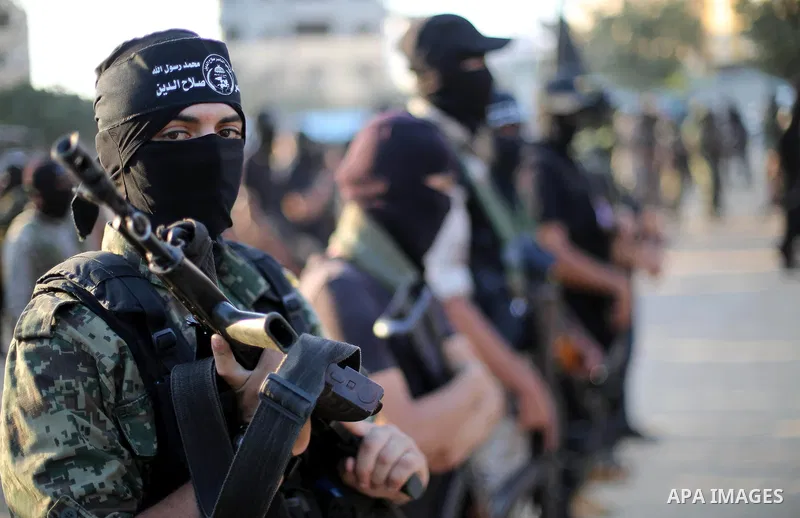 Palestinian militants from the Al-Nasser Brigades, an armed wing of the Popular Resistance Committees (PRC), take part in a military parade, in Gaza city, on September 29, 2017, to mark the 17th anniversary of the creati...