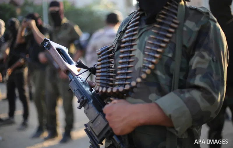 Palestinian militants from the Al-Nasser Brigades, an armed wing of the Popular Resistance Committees (PRC), take part in a military parade, in Gaza city, on September 29, 2017, to mark the 17th anniversary of the creati...