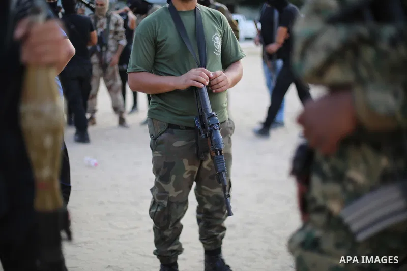 Palestinian militants from the Al-Nasser Brigades, an armed wing of the Popular Resistance Committees (PRC), take part in a military parade, in Gaza city, on September 29, 2017, to mark the 17th anniversary of the creati...