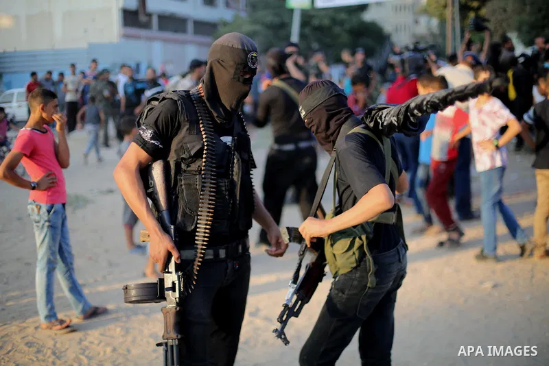 Palestinian militants from the Al-Nasser Brigades, an armed wing of the Popular Resistance Committees (PRC), take part in a military parade, in Gaza city, on September 29, 2017, to mark the 17th anniversary of the creati...
