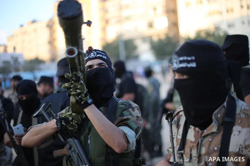 Palestinian militants from the Al-Nasser Brigades, an armed wing of the Popular Resistance Committees (PRC), take part in a military parade, in Gaza city, on September 29, 2017, to mark the 17th anniversary of the creati...