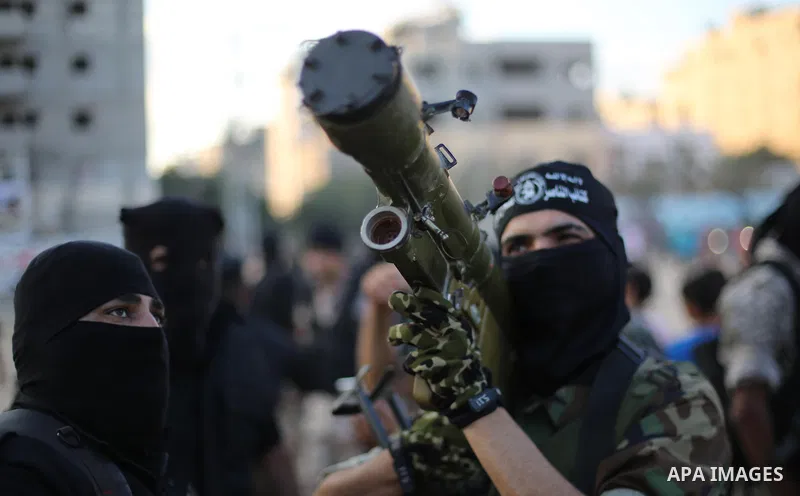 Palestinian militants from the Al-Nasser Brigades, an armed wing of the Popular Resistance Committees (PRC), take part in a military parade, in Gaza city, on September 29, 2017, to mark the 17th anniversary of the creati...
