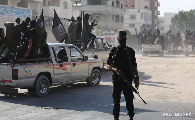 Palestinian militants from the Al-Nasser Brigades, an armed wing of the Popular Resistance Committees (PRC), take part in a military parade, in Gaza city, on September 29, 2017, to mark the 17th anniversary of the creati...