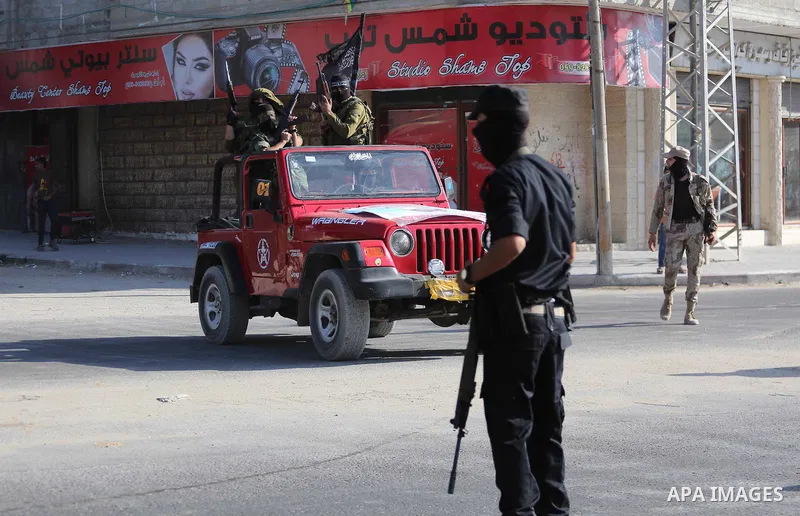 Palestinian militants from the Al-Nasser Brigades, an armed wing of the Popular Resistance Committees (PRC), take part in a military parade, in Gaza city, on September 29, 2017, to mark the 17th anniversary of the creati...