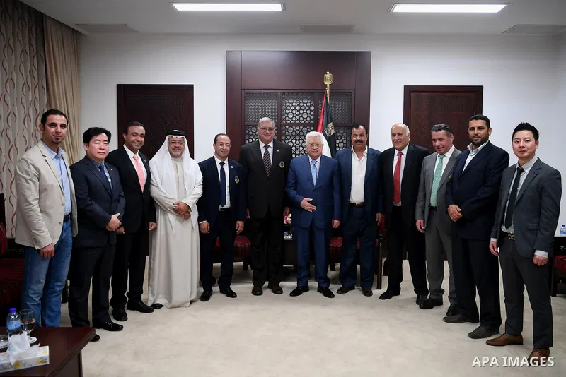 Palestinian President Mahmoud Abbas meets with a delegation from the international and arab Taekwondo union, in the West Bank city of Ramallah on September 29, 2017. Photo by Osama Falah