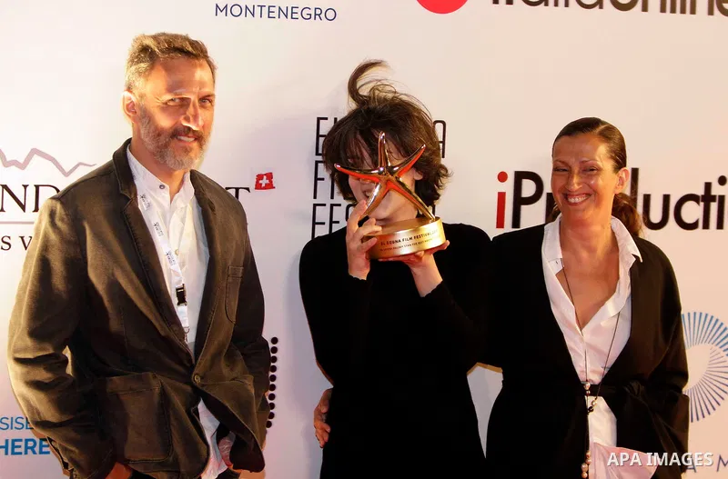 Georgian film director Ana Urushadze poses with her Golden Star for Best Feature Narrative Film award next to actor Dimitri Tatishvili and actress Nato Murvanidze during the closing ceremony of the El-Gouna Film Festival...