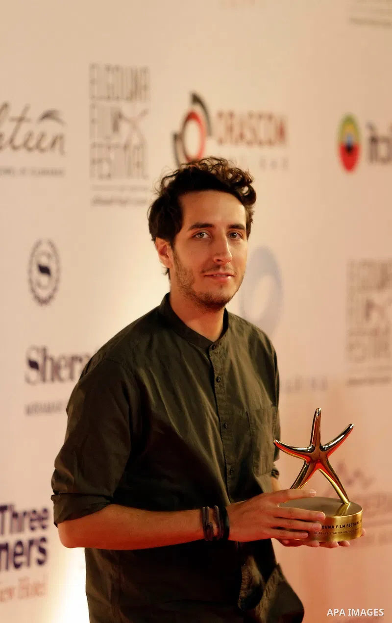 Filmmaker Christophe M. Saber poses with his best Arab Short Film award during the closing ceremony of the El-Gouna Film Festival, in the Red Sead resort of El-Gouna in Egypt, on September 29, 2017. Photo by Amr Sayed