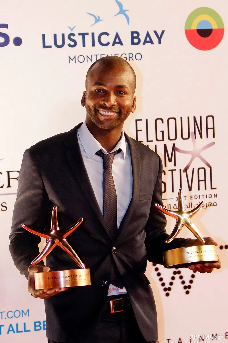 French-Senegalese filmmaker Ibrahima Saydi poses with the Best Short Film award and his Bronze Star for the Best Short Film award during the closing ceremony of the El-Gouna Film Festival, in the Red Sead resort of El-Go...