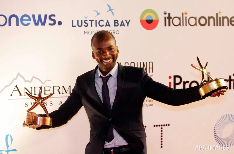 French-Senegalese filmmaker Ibrahima Saydi poses with the Best Short Film award and his Bronze Star for the Best Short Film award during the closing ceremony of the El-Gouna Film Festival, in the Red Sead resort of El-Go...