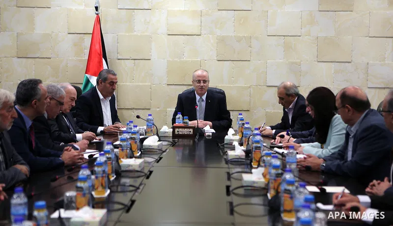 Palestinian Prime Minister, Rami hamdallah, chairs a Ministerial meeting in the West Bank city of Ramallah on October 1, 2017. Photo by Prime Minister Office