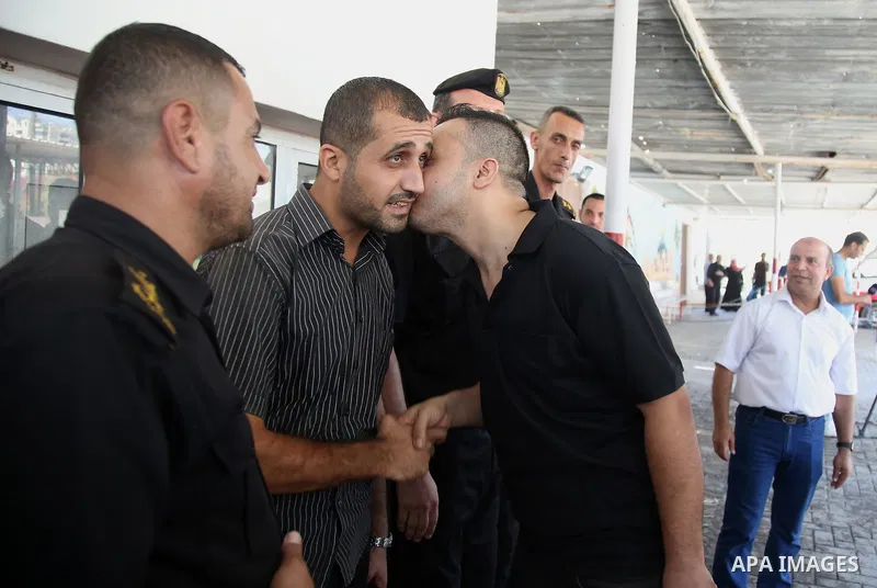 A member of the Palestinian Fatah movement, is greeted in Gaza City after his release from a Hamas-run jail as part of reconciliation efforts on October 1, 2017. Photo by Hassan Jedi
