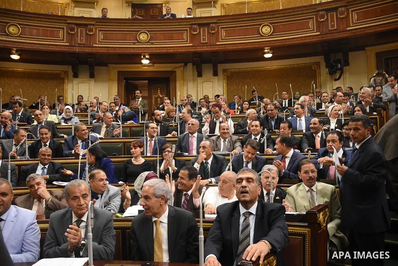 Egyptian parliament members attend a meeting of the opening session of the Parliament, in Cairo, Egypt, on October 2, 2017. Photo by Stringer