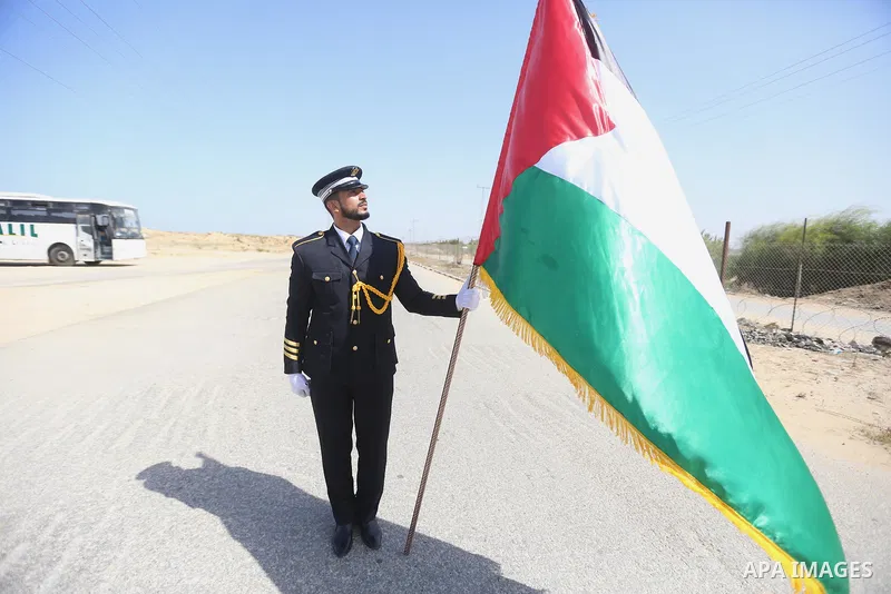 Palestinian honor guards as they wait for the arrival of Palestinian Prime Minister Rami Hamdallah and his government at Erez crossing in the northern Gaza Strip, on October 2, 2017. Hamdallah is on on his first visit to...