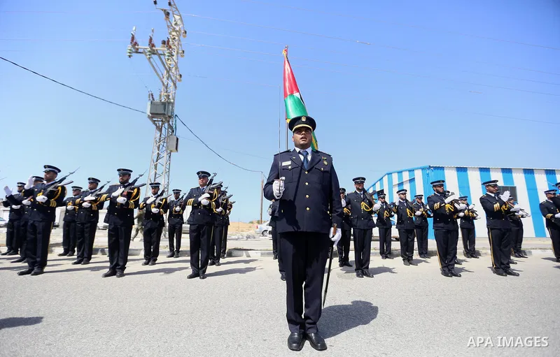 Palestinian honor guards as they wait for the arrival of Palestinian Prime Minister Rami Hamdallah and his government at Erez crossing in the northern Gaza Strip, on October 2, 2017. Hamdallah is on on his first visit to...