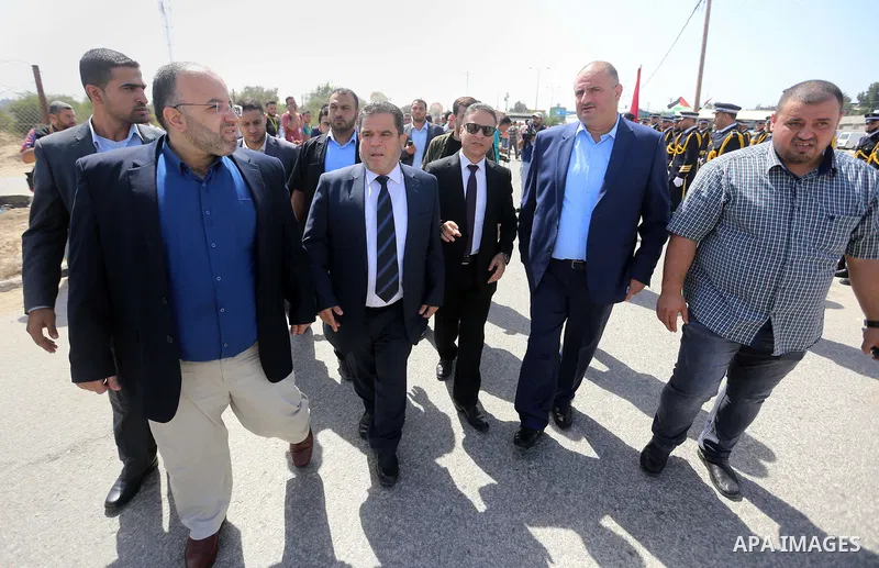 Palestinian officials wait for the arrival of Palestinian Prime Minister Rami Hamdallah and his government at Erez crossing in the northern Gaza Strip, on October 2, 2017. Hamdallah is on on his first visit to the Gaza S...