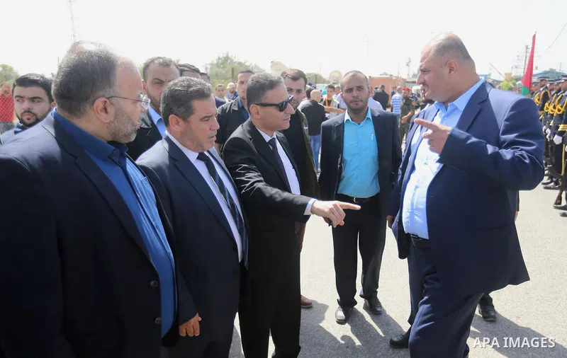 Palestinian officials wait for the arrival of Palestinian Prime Minister Rami Hamdallah and his government at Erez crossing in the northern Gaza Strip, on October 2, 2017. Hamdallah is on on his first visit to the Gaza S...