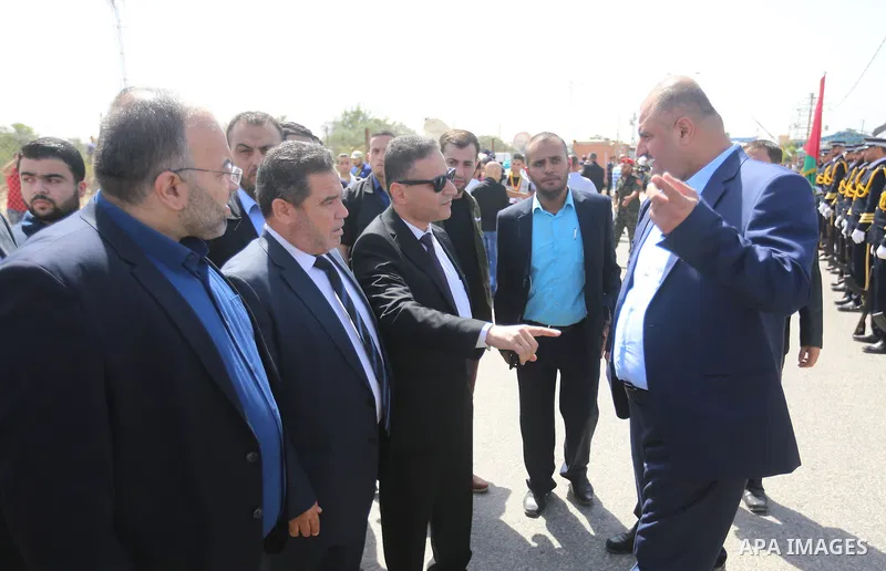 Palestinian officials wait for the arrival of Palestinian Prime Minister Rami Hamdallah and his government at Erez crossing in the northern Gaza Strip, on October 2, 2017. Hamdallah is on on his first visit to the Gaza S...