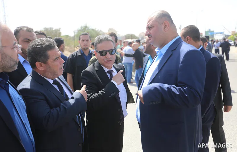 Palestinian officials wait for the arrival of Palestinian Prime Minister Rami Hamdallah and his government at Erez crossing in the northern Gaza Strip, on October 2, 2017. Hamdallah is on on his first visit to the Gaza S...