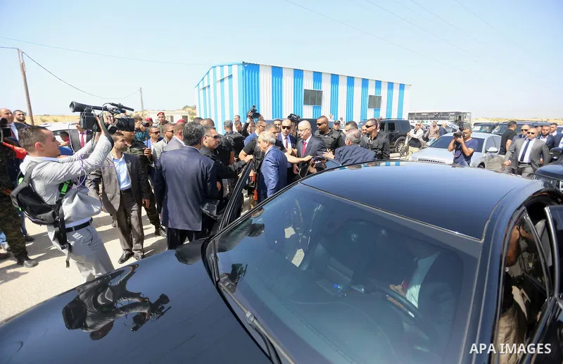 Palestinian prime minister Rami Hamdallah is surrounded by security as he arrives at the Erez border crossing in the northern Gaza Strip on October 2, 2017. Hamdallah is on on his first visit to the Gaza Strip for talks...