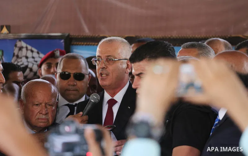 Palestinian Prime Minister Rami Hamdallah makes a statement after his arrival at the Erez border crossing in the northern Gaza Strip on October 2, 2017. Hamdallah is on on his first visit to the Gaza Strip for talks aime...
