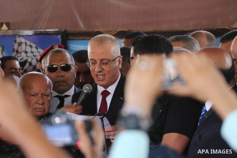 Palestinian Prime Minister Rami Hamdallah makes a statement after his arrival at the Erez border crossing in the northern Gaza Strip on October 2, 2017. Hamdallah is on on his first visit to the Gaza Strip for talks aime...