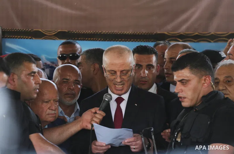 Palestinian Prime Minister Rami Hamdallah makes a statement after his arrival at the Erez border crossing in the northern Gaza Strip on October 2, 2017. Hamdallah is on on his first visit to the Gaza Strip for talks aime...